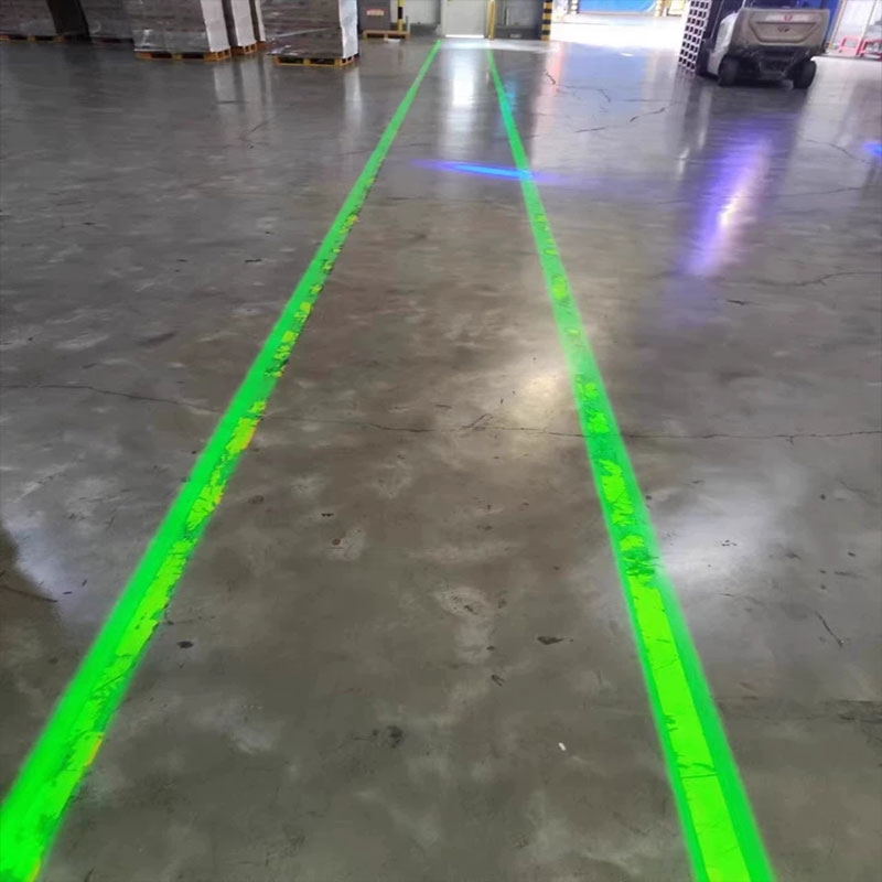 How to Project a Clear Safety Line from 10 Meters High in an Industrial Warehouse