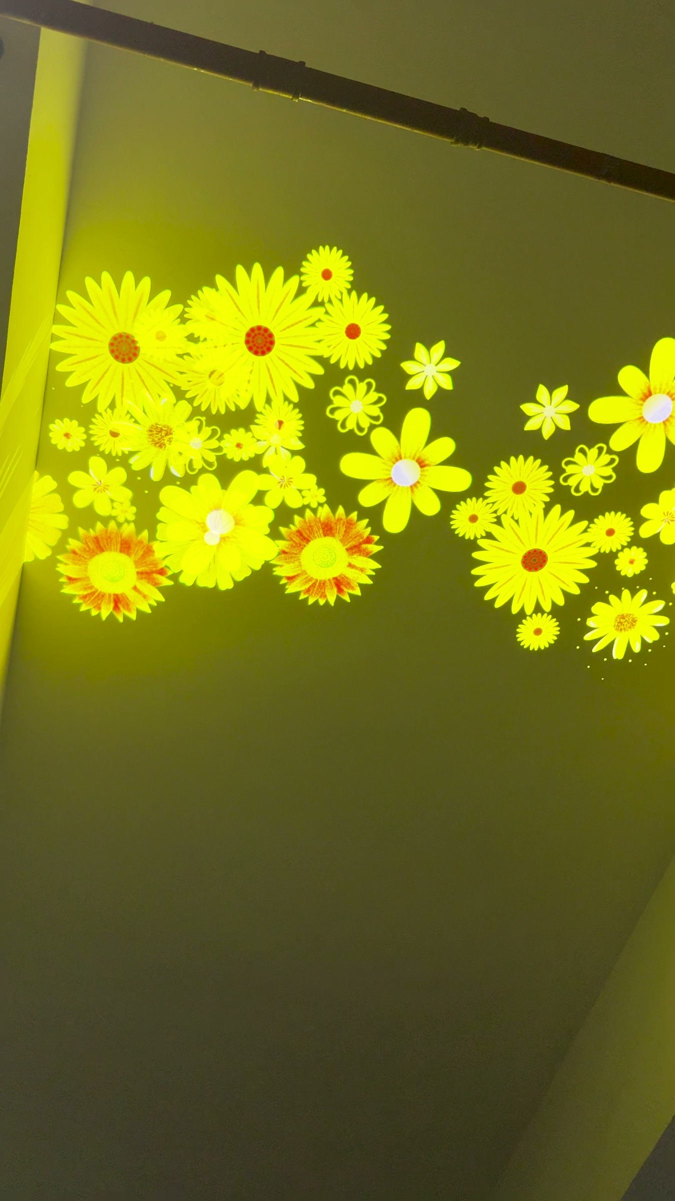Decorative gobo projection: a floral pattern on the wall.