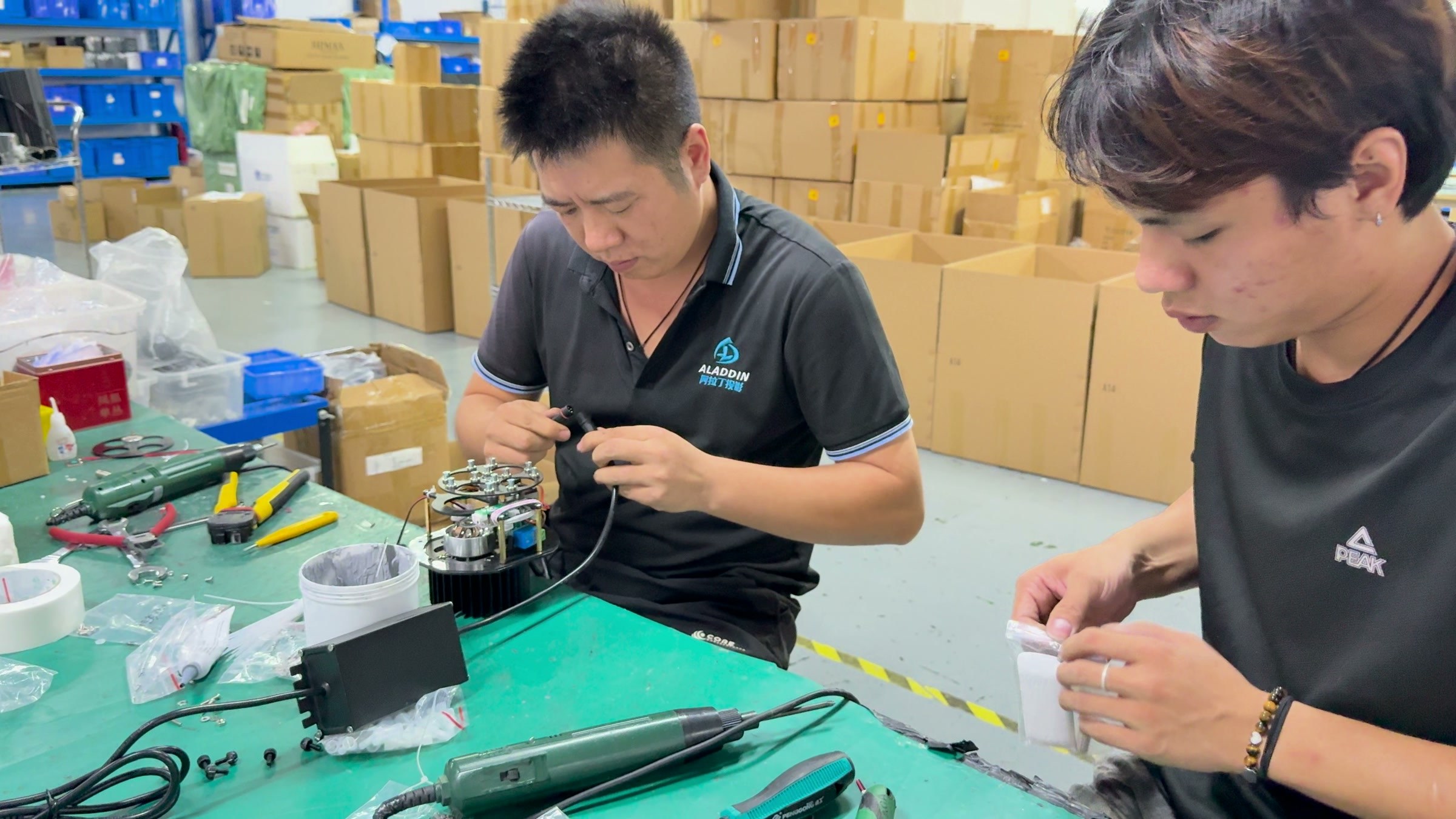 NOPARDE gobo projector assembly at the workbench.